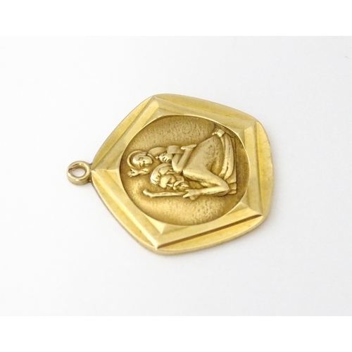 687 - A 9ct gold St Christopher pendant. Approx 3/4