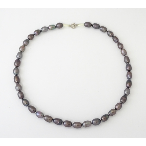 692 - A necklace of black pearl beads. Approx. 16