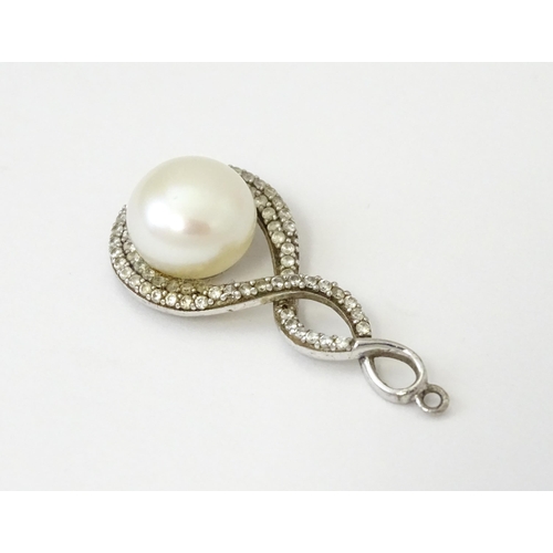 695 - Three items of jewellery comprising a silver pendant set with pearl, a necklace set with pearl beads... 