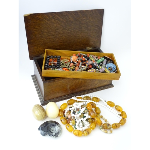 706 - A quantity of assorted costume jewellery to include various bead necklaces including Venetian beads,... 