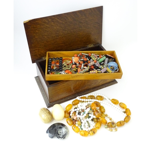 706 - A quantity of assorted costume jewellery to include various bead necklaces including Venetian beads,... 