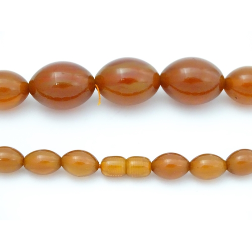 710 - A vintage necklace of graduated amber coloured beads. Approx. 3