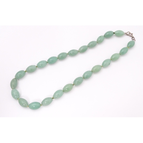 715 - A necklace of jade coloured beads. Approx. 16