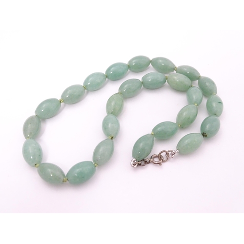 715 - A necklace of jade coloured beads. Approx. 16