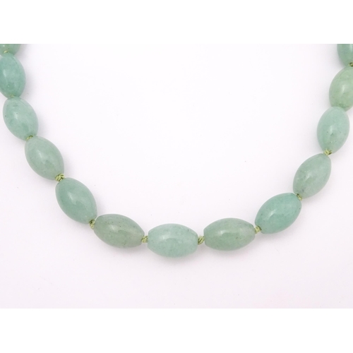 715 - A necklace of jade coloured beads. Approx. 16