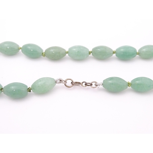 715 - A necklace of jade coloured beads. Approx. 16