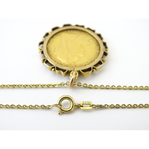 721 - Coin: An 1897 Victorian gold sovereign in yellow metal captive pendant mount, with 18