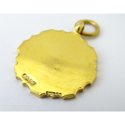 724 - Football Interest : A 9ct gold medal / fob with enamel detail, titled Connaught Hospital Charity Cup... 