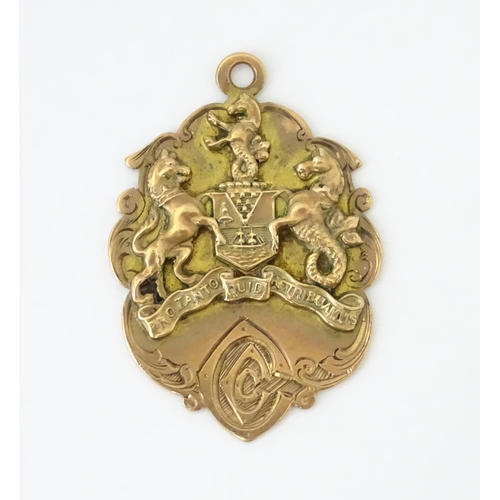 725 - Football Interest : A 9ct gold medal / fob depicting the Coat of Arms of Belfast, and ascribed to th... 