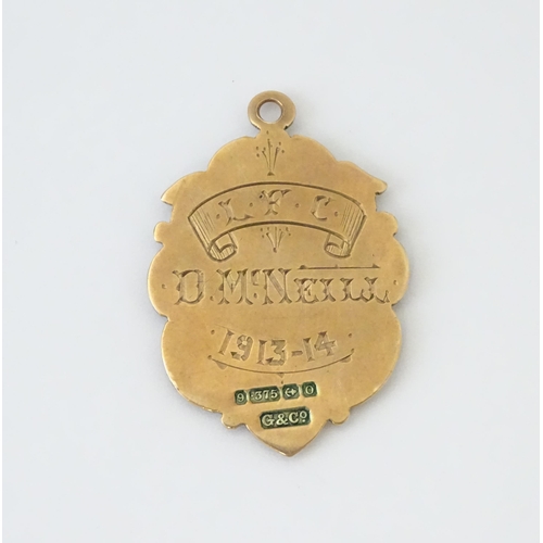 725 - Football Interest : A 9ct gold medal / fob depicting the Coat of Arms of Belfast, and ascribed to th... 