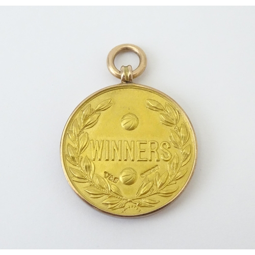 727 - Football Interest : A cased 9ct gold medal / fob for The Football Association Amateur Cup Winners, h... 