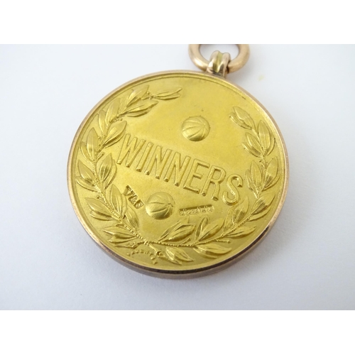 727 - Football Interest : A cased 9ct gold medal / fob for The Football Association Amateur Cup Winners, h... 