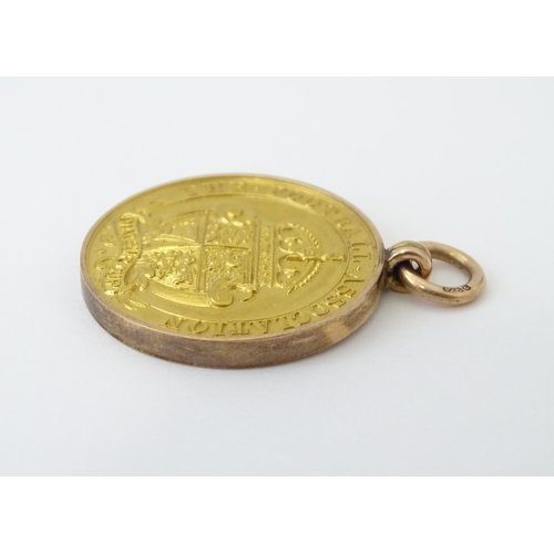 727 - Football Interest : A cased 9ct gold medal / fob for The Football Association Amateur Cup Winners, h... 