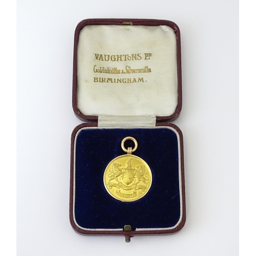 729 - Football Interest : A cased 15ct gold medal / fob for London Football Association Challenge Cup, hal... 