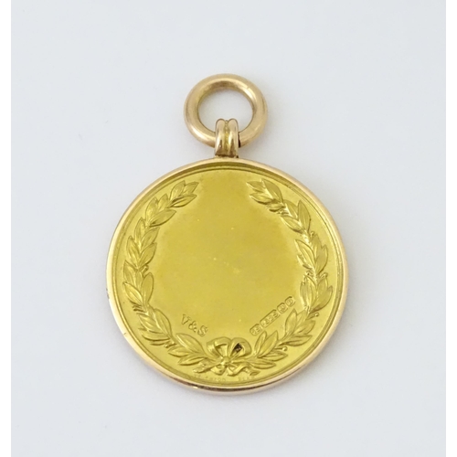 729 - Football Interest : A cased 15ct gold medal / fob for London Football Association Challenge Cup, hal... 