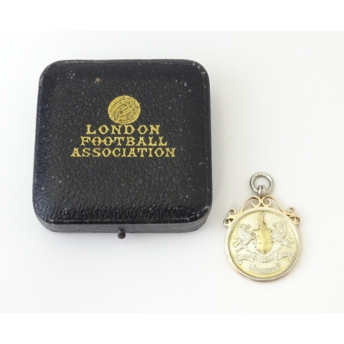 730 - Football Interest : A cased silver medal / fob for London Football Association Challenge Cup, hallma... 