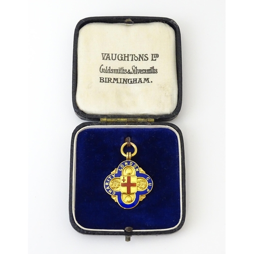 731 - Football Interest : A cased 9ct gold medal / fob with enamel decoration for London Charity Cup, and ... 