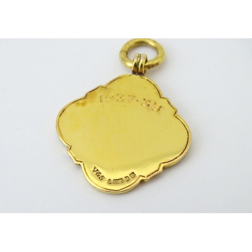 731 - Football Interest : A cased 9ct gold medal / fob with enamel decoration for London Charity Cup, and ... 