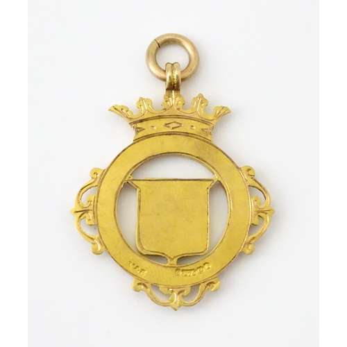 732 - Football Interest : A cased 9ct gold medal / fob with enamel decoration for Essex County Senior Chal... 
