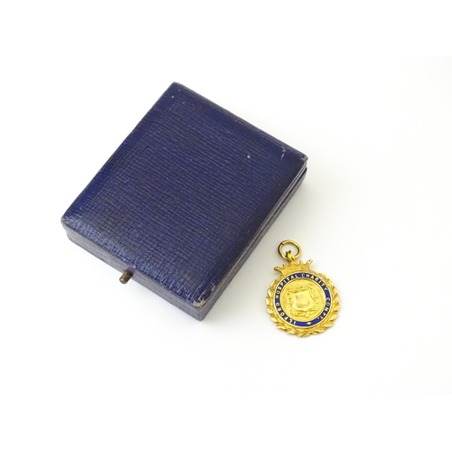 733 - Football Interest : A cased 9ct gold medal / fob with enamel decoration for Ilford Hospital Charity ... 