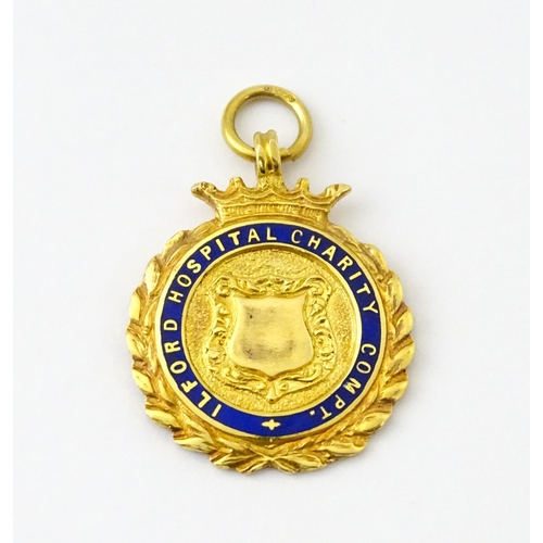 733 - Football Interest : A cased 9ct gold medal / fob with enamel decoration for Ilford Hospital Charity ... 