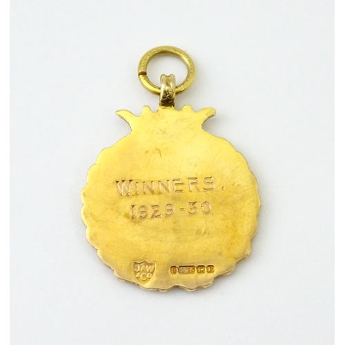 733 - Football Interest : A cased 9ct gold medal / fob with enamel decoration for Ilford Hospital Charity ... 