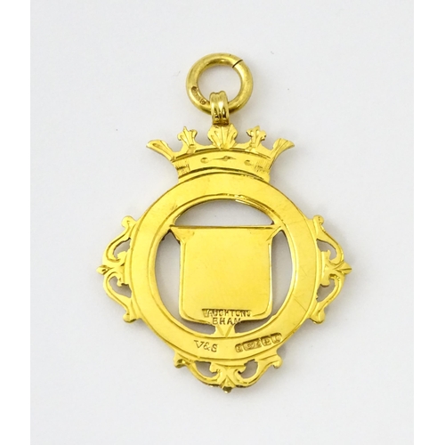 734 - Football Interest : A cased 9ct gold medal / fob with enamel decoration for Essex County Senior Chal... 