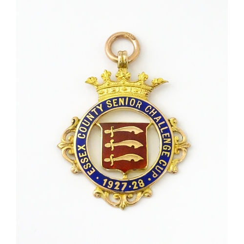 735 - Football Interest : A cased 9ct gold medal / fob with enamel decoration for Essex County Senior Chal... 