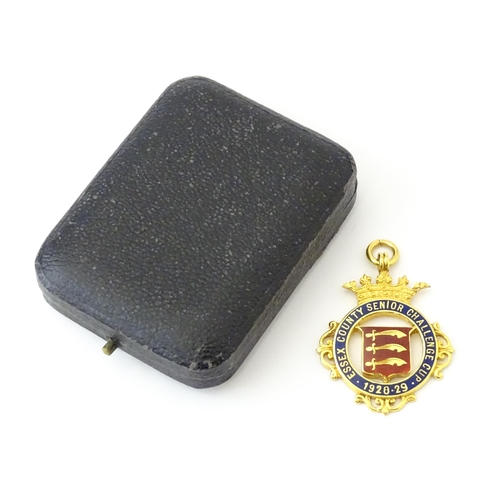 736 - Football Interest : A cased 9ct gold medal / fob with enamel decoration for Essex County Senior Chal... 