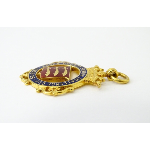 736 - Football Interest : A cased 9ct gold medal / fob with enamel decoration for Essex County Senior Chal... 