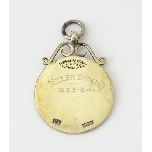 737 - Football Interest : A cased silver medal / fob with enamel decoration for Norfolk County Football As... 