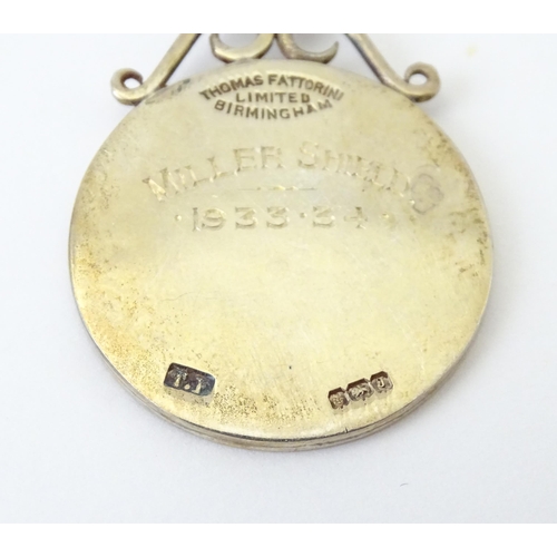 737 - Football Interest : A cased silver medal / fob with enamel decoration for Norfolk County Football As... 