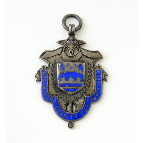 738 - Football Interest : A silver medal / fob with enamel decoration for Chelmsford Charity Cup Comptn (C... 