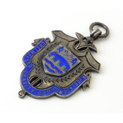 738 - Football Interest : A silver medal / fob with enamel decoration for Chelmsford Charity Cup Comptn (C... 