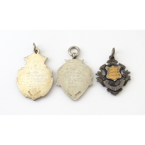 739 - Sporting Interest: Three assorted silver fobs comprising one engraved West Ham Charity Cup Finalist ... 