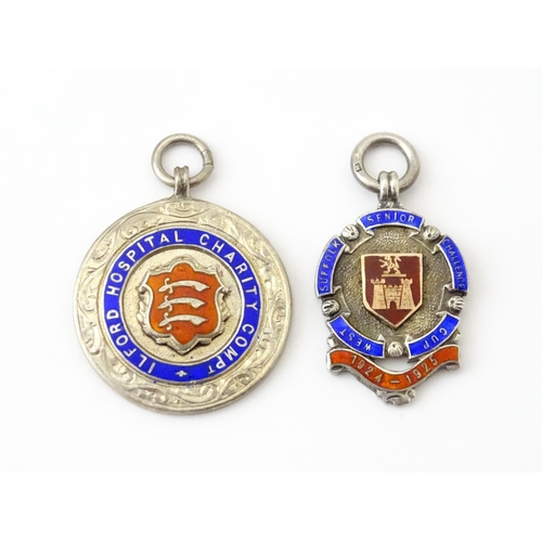 740 - Football Interest: Two silver and enamel fobs / medals, one for Ilford Hospital Charity Compt, the o... 