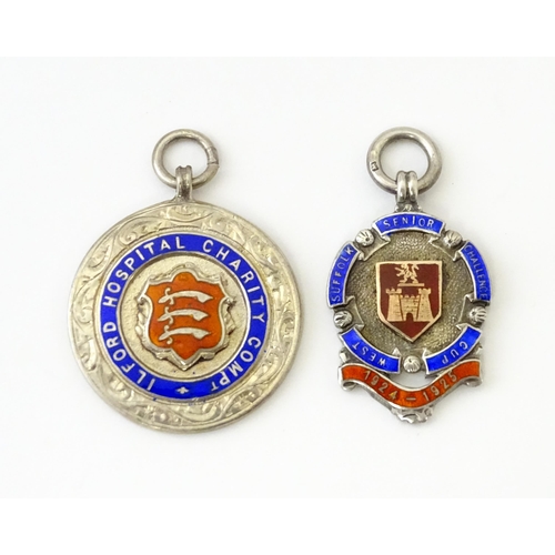 740 - Football Interest: Two silver and enamel fobs / medals, one for Ilford Hospital Charity Compt, the o... 