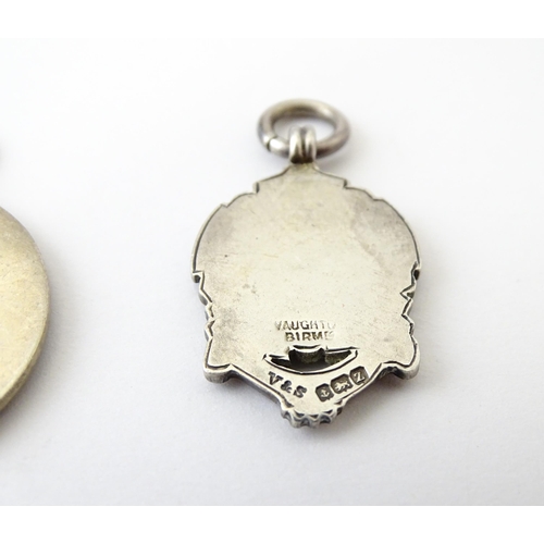 740 - Football Interest: Two silver and enamel fobs / medals, one for Ilford Hospital Charity Compt, the o... 