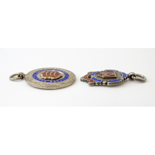 740 - Football Interest: Two silver and enamel fobs / medals, one for Ilford Hospital Charity Compt, the o... 