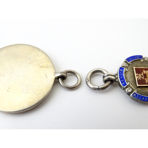 740 - Football Interest: Two silver and enamel fobs / medals, one for Ilford Hospital Charity Compt, the o... 