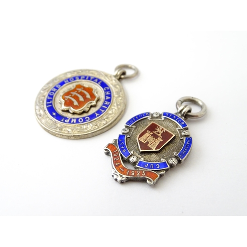 740 - Football Interest: Two silver and enamel fobs / medals, one for Ilford Hospital Charity Compt, the o... 