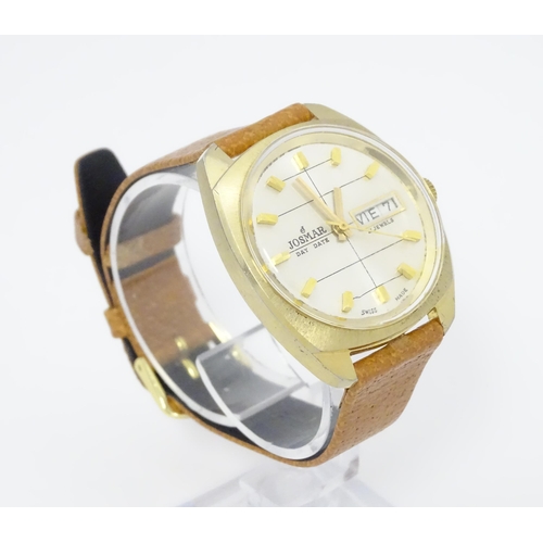 744 - A Josmar gentlemans automatic wristwatch with day date aperture and 21 jewel movement. Dial approx. ... 