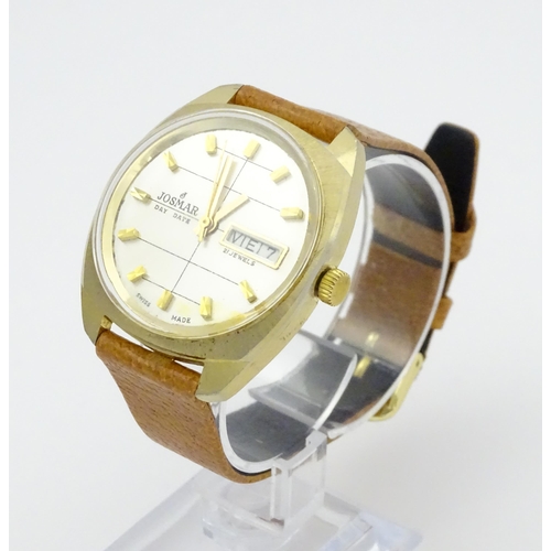 744 - A Josmar gentlemans automatic wristwatch with day date aperture and 21 jewel movement. Dial approx. ... 