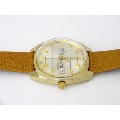 744 - A Josmar gentlemans automatic wristwatch with day date aperture and 21 jewel movement. Dial approx. ... 