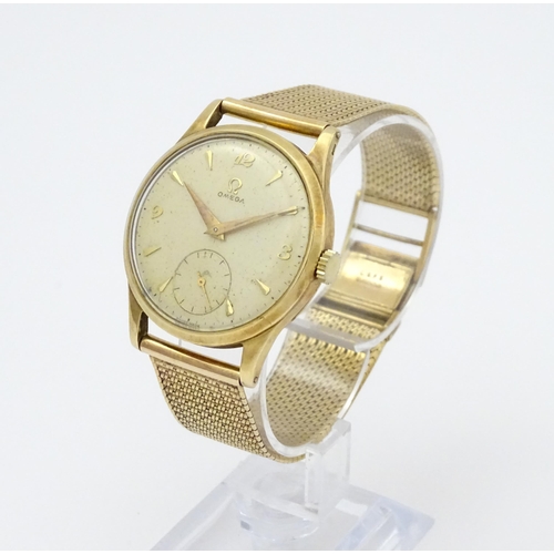 746 - A 9ct gold cased 1950s Omega gentlemans manual wind wristwatch with subsidiary seconds dial, the cas... 