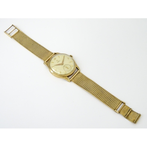 746 - A 9ct gold cased 1950s Omega gentlemans manual wind wristwatch with subsidiary seconds dial, the cas... 