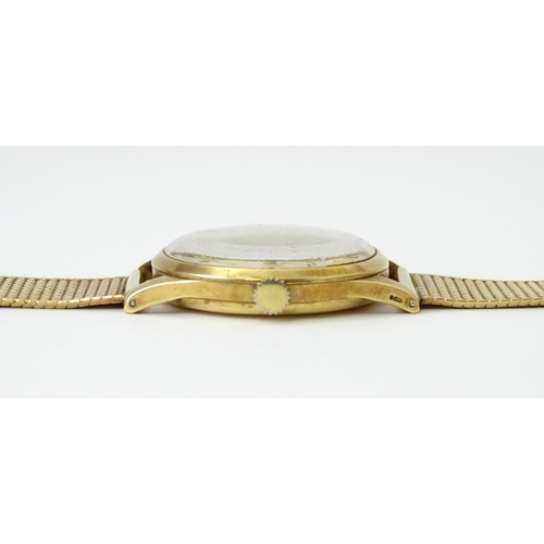 746 - A 9ct gold cased 1950s Omega gentlemans manual wind wristwatch with subsidiary seconds dial, the cas... 