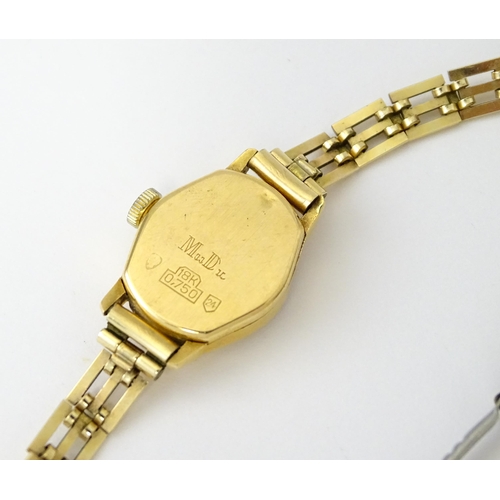 748 - Two 18ct gold cased ladies manual wind wristwatches by MuDu. Largest dial approx. 1/2