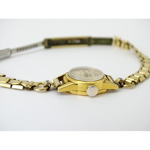 748 - Two 18ct gold cased ladies manual wind wristwatches by MuDu. Largest dial approx. 1/2