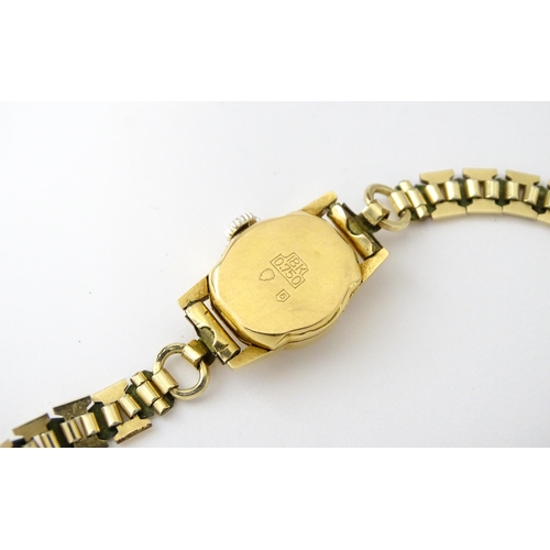 748 - Two 18ct gold cased ladies manual wind wristwatches by MuDu. Largest dial approx. 1/2